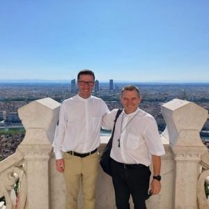 WYD 23 Bishop Michael and Fr Monty overlooking Lyon