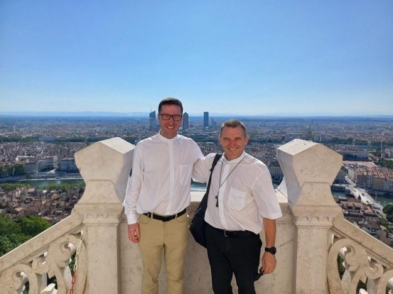 WYD 23 Bishop Michael and Fr Monty overlooking Lyon