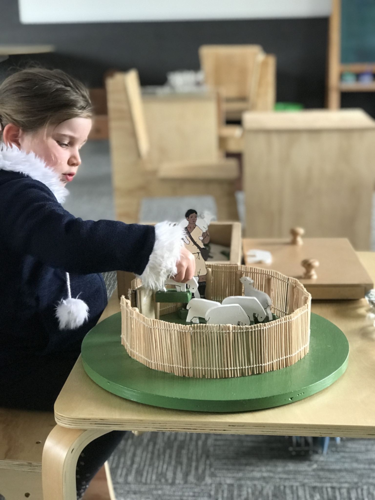 3 year old working with the Good Shepherd