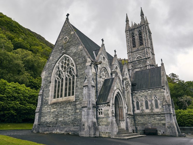 Low angle shot kylemore abbey ireland surrounded by greenery